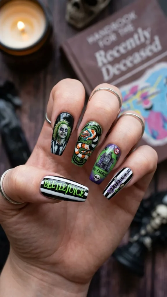 Beetlejuice-inspired nails with bold striped details.
