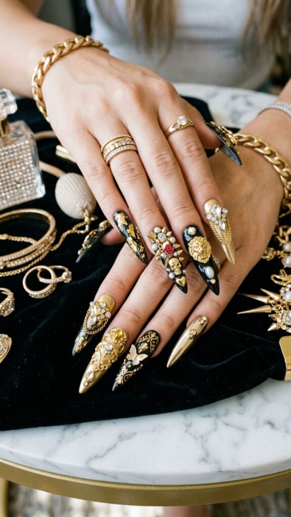  Black and gold nails with luxurious metallic accents, crystals, charms, and glamorous 3D junk nail details.