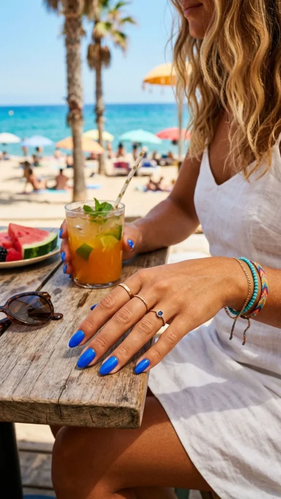 Bold electric blue nails make a striking statement with a vibrant, energetic, and eye-catching summer finish.