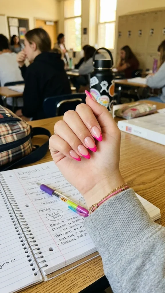 Glossy hot pink French tip nails with a vibrant finish for a bold and trendy manicure.