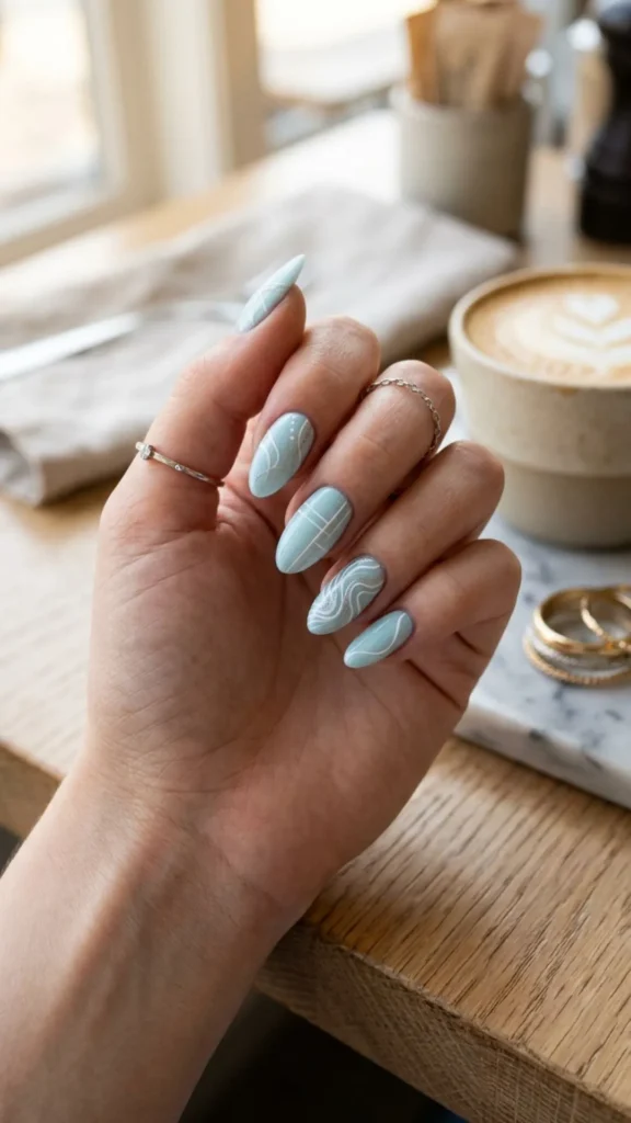  Ice blue micro line nails with trendy glossy finish