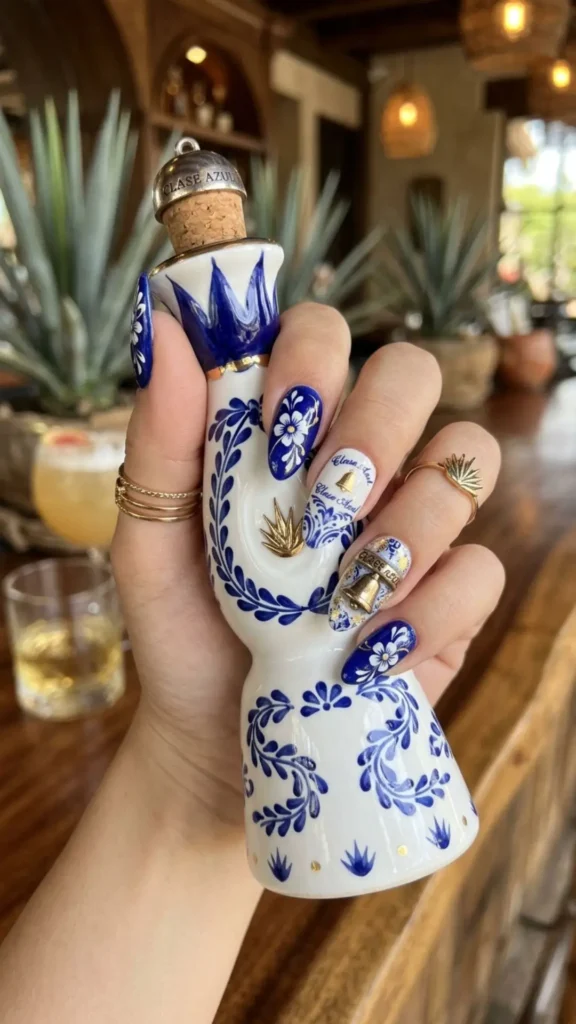 Clase Azul-inspired luxury bottle nail art with elegant blue and white details.