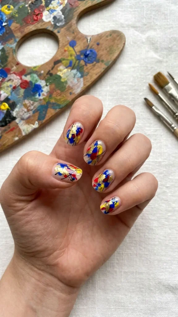 Artistic hand-painted nail designs featuring creative details and unique patterns.