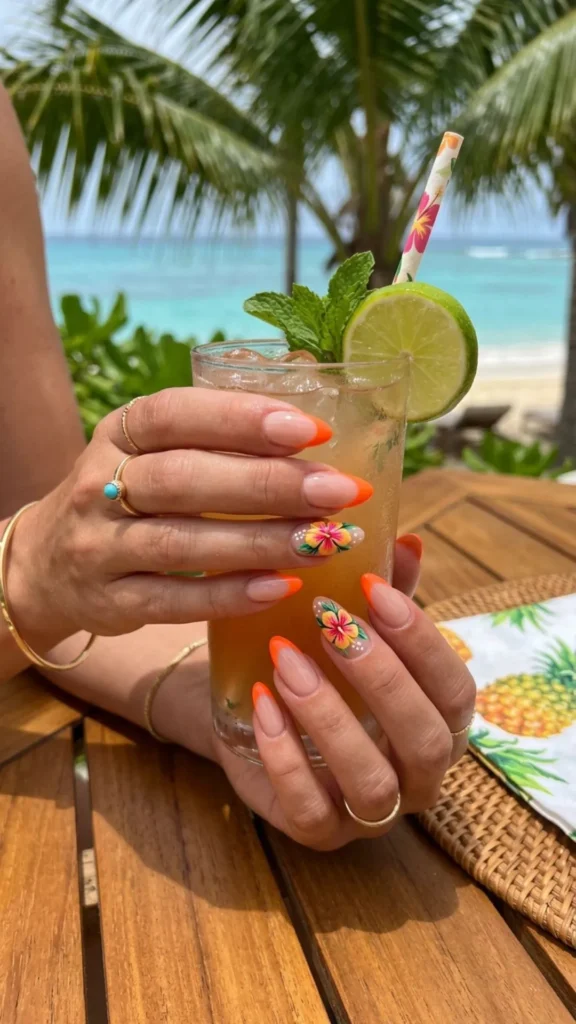 Neon tangerine French tips with a vibrant tropical flower accent.