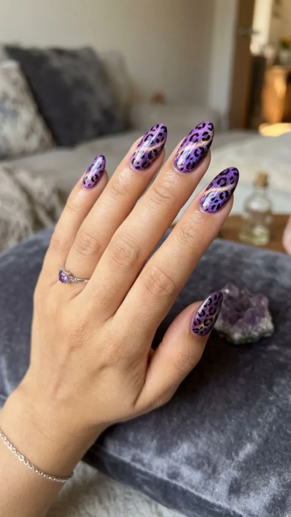 Purple magnetic cheetah nails with a shimmering cat-eye effect.