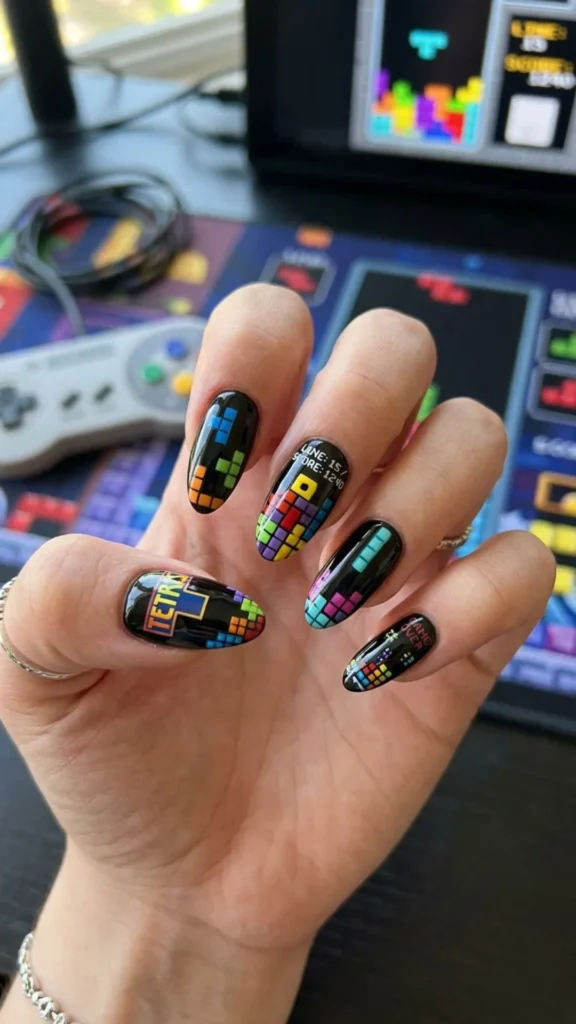 Colorful Tetris-inspired nails with playful geometric blocks.